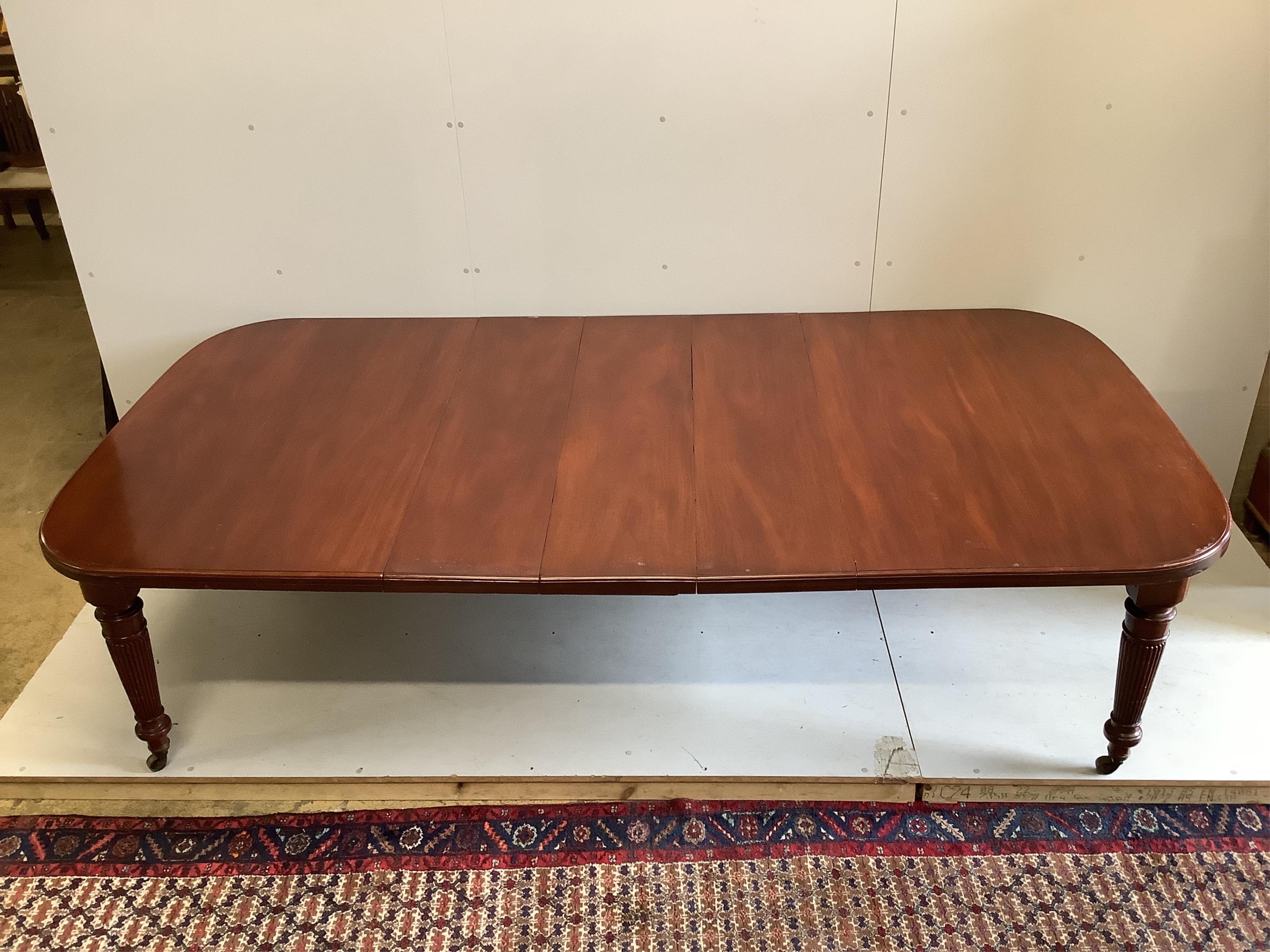 A late Victorian mahogany extending dining table, width 270cm extended, three spare leaves, depth 136cm, height 74cm. Condition - fair